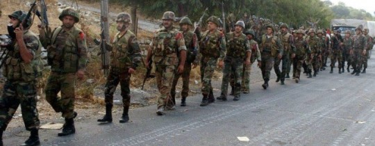 افراد من الجيش السوري على مشارف جسر الشغور