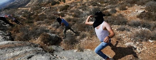 من المواجهات التي اندلعت في راس كركر غرب رام الله - وكالات