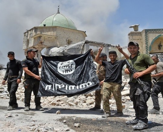 أرشيفية- اسقاط علم داعش في العراق